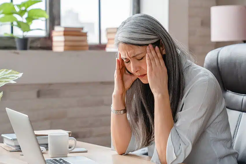 woman with a migraine headache