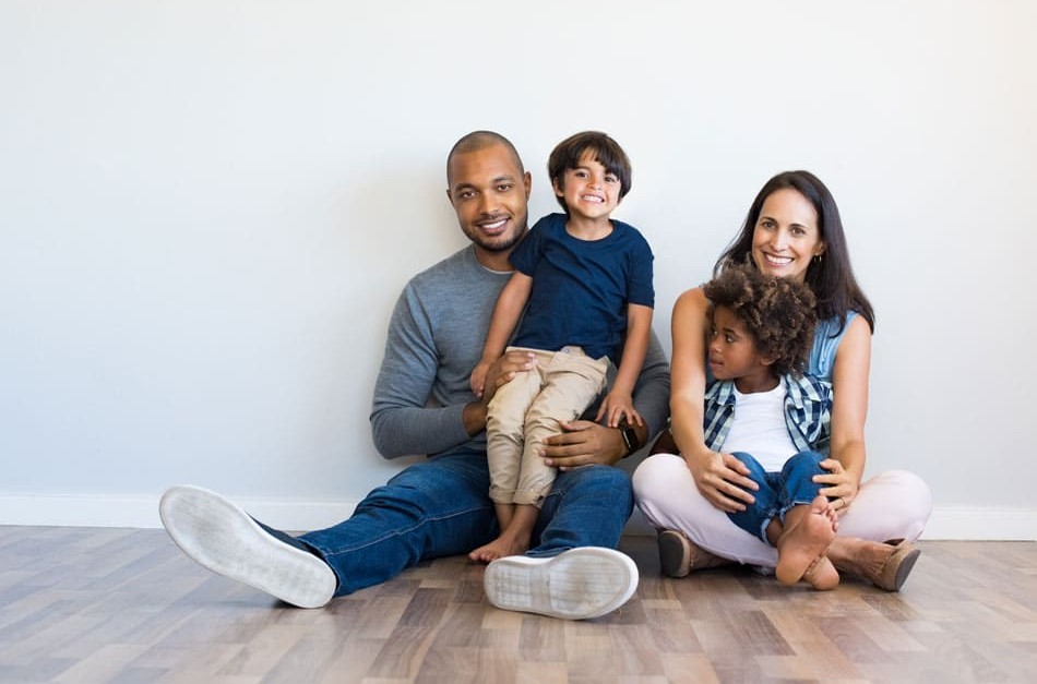 family sitting together smiling